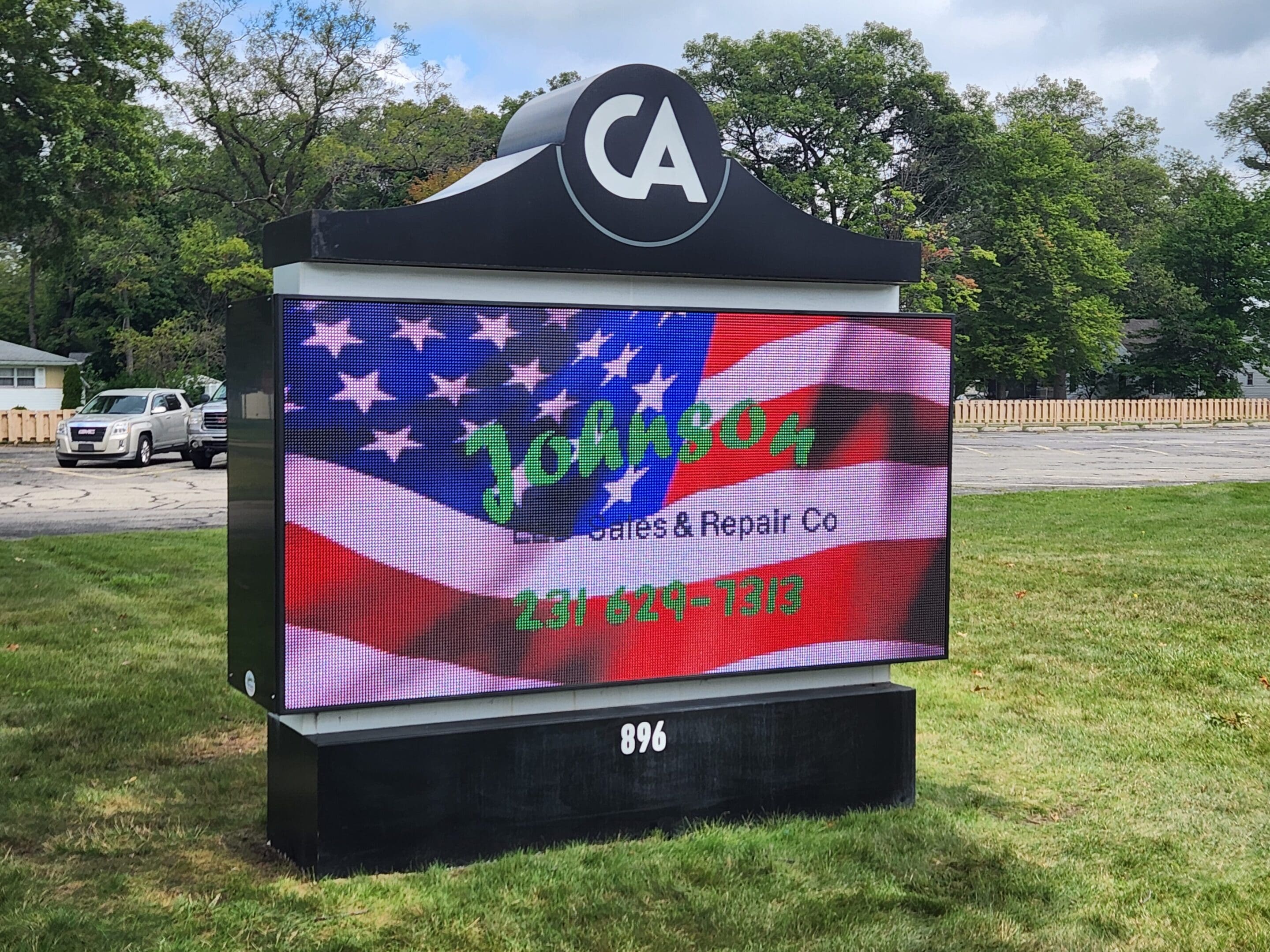 A large sign with an american flag on it.